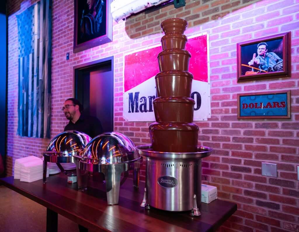Chocolate fountain and buffet setup with vintage decor at Bottled Blonde