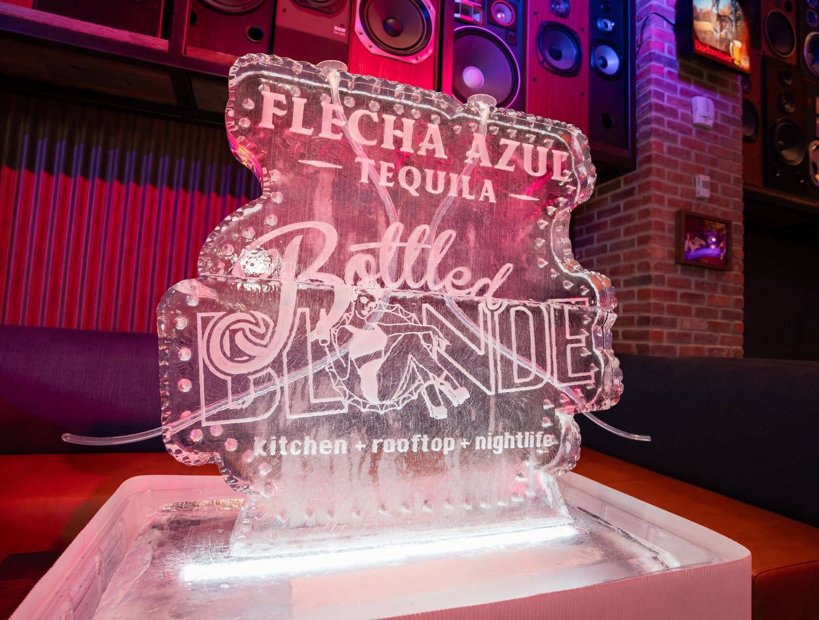 Flecha Azul Tequila Bottled Blonde ice sculpture display inside the venue.
