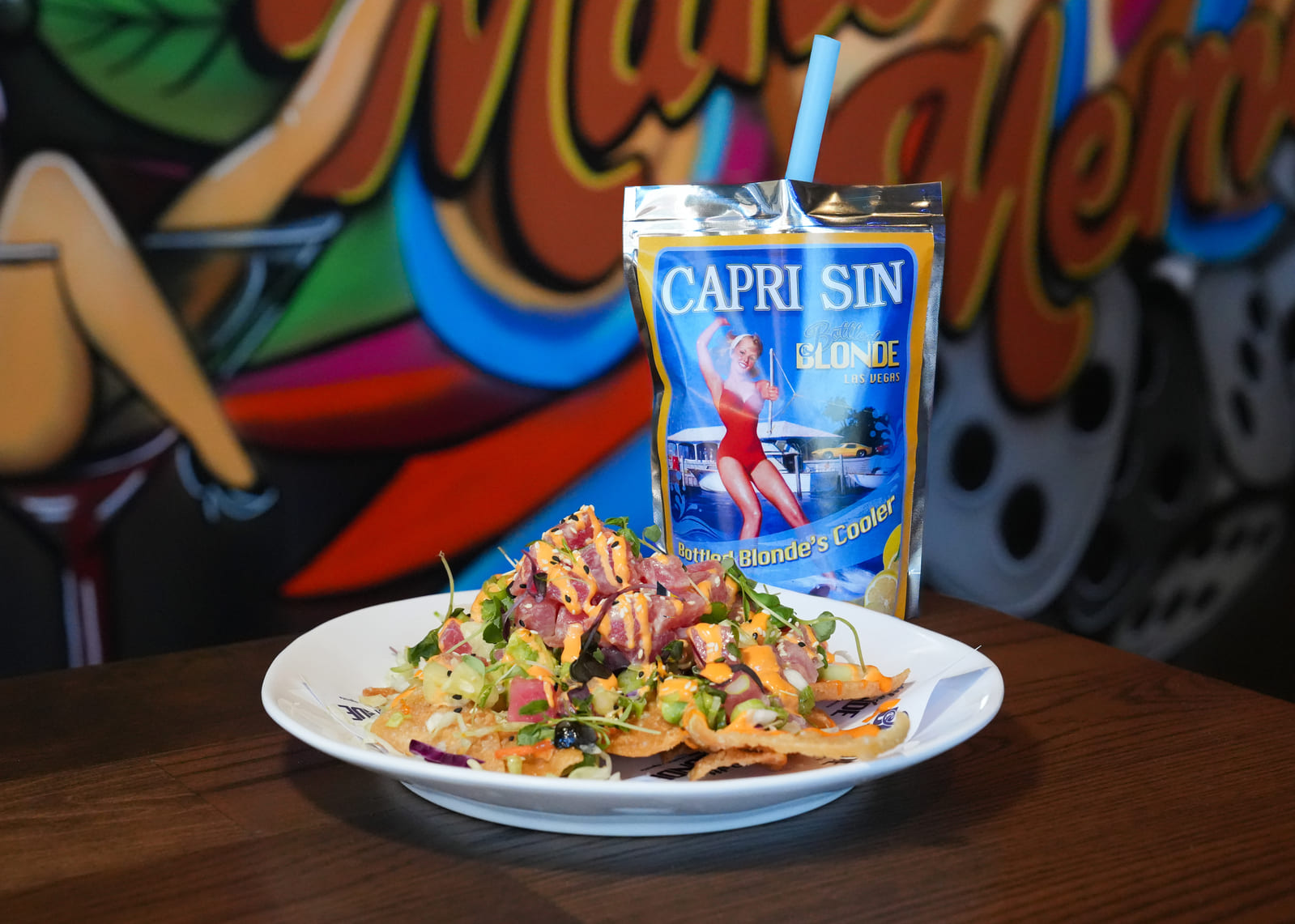 Tuna nachos with diced vegetables and a Capri Sun-style drink pouch